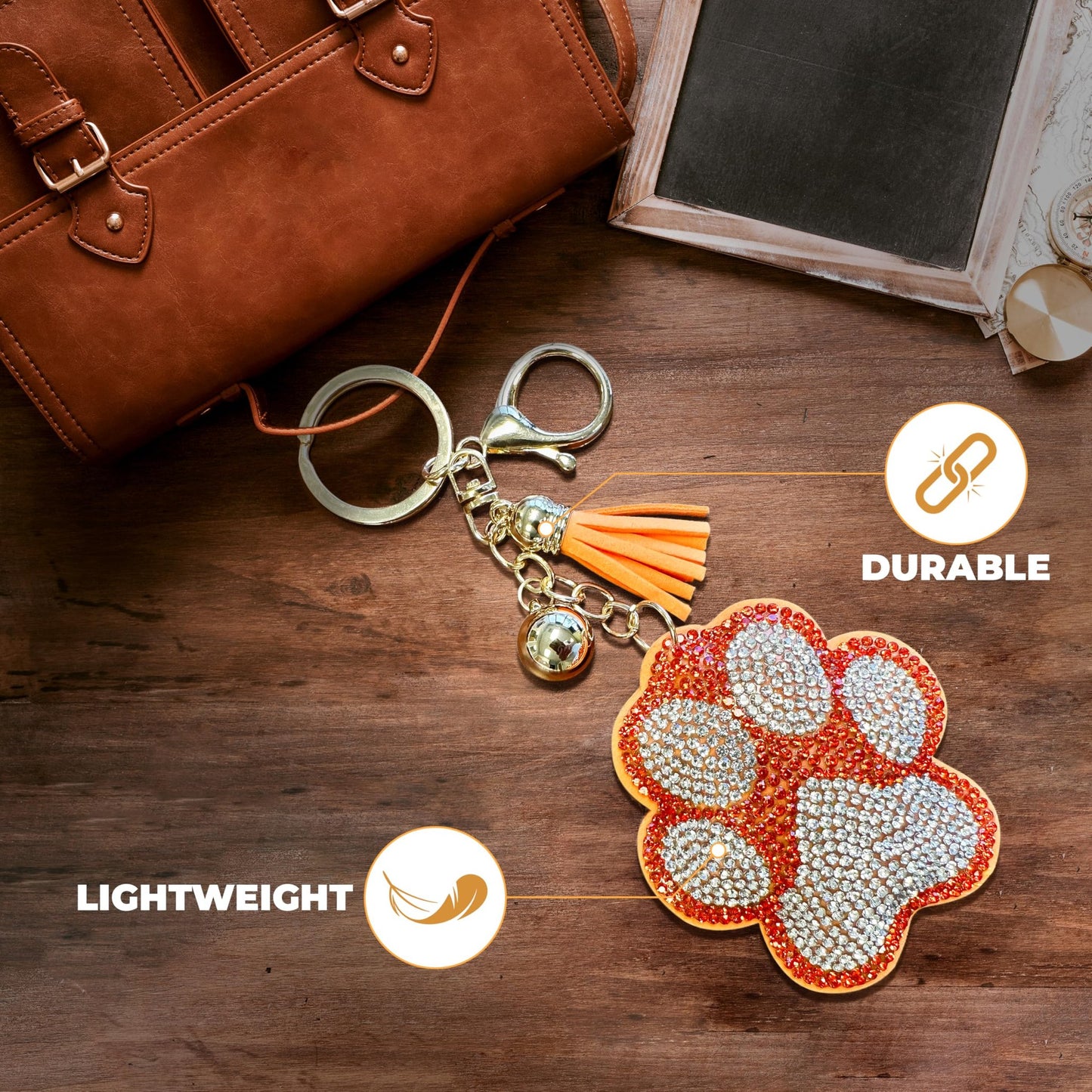 THE MARDI GRAS KREWE Bling Paw Print Keychain, orange & silver rhinestone charm, lightweight bag clip accessory